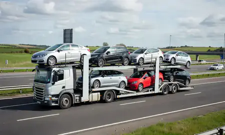 Multi-level car carrier on the motorway to Walsall, West Midlands, United Kingdom