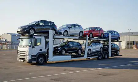 Car transporter loaded with vehicles in West Bromwich, West Midlands, United Kingdom