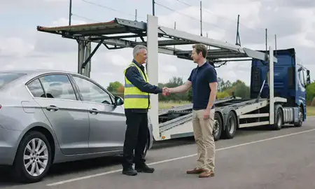 Vehicle owner beside their delivered car in Willenhall, West Midlands, United Kingdom