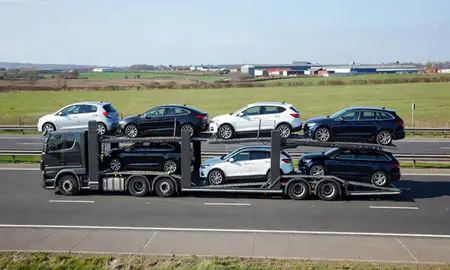 Multi-level car carrier on the motorway to Wolverhampton, West Midlands, United Kingdom
