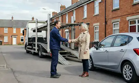 Vehicle owner beside their delivered car in Wolverhampton, West Midlands, United Kingdom
