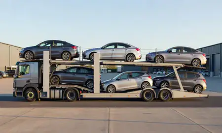 Car transporter parked in an industrial area of West Sussex, United Kingdom