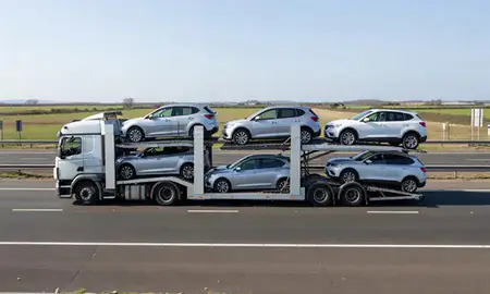 Multi-level car carrier on the motorway to Bognor Regis, West Sussex, United Kingdom