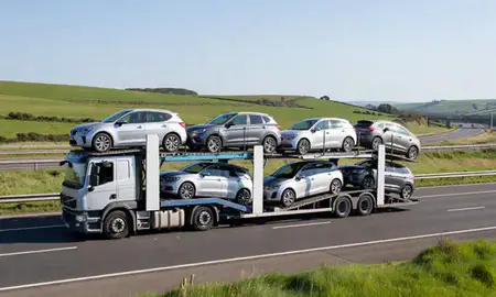 Multi-level car carrier on the motorway to Shoreham-by-Sea, West Sussex, United Kingdom