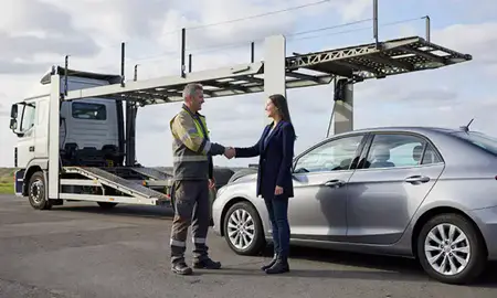 Vehicle owner beside their delivered car in Shoreham-by-Sea, West Sussex, United Kingdom