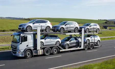 Multi-level car carrier on the motorway to Worthing, West Sussex, United Kingdom
