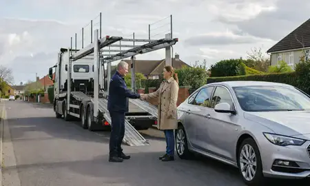 Vehicle owner beside their delivered car in Worthing, West Sussex, United Kingdom