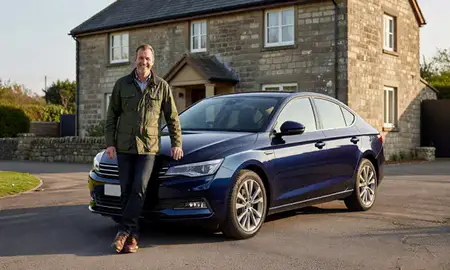 Customer with their delivered car in West Yorkshire, United Kingdom