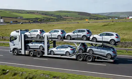 Multi-level car carrier on the motorway to Batley, West Yorkshire, United Kingdom