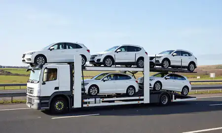 Multi-level car carrier on the motorway to Bradford, West Yorkshire, United Kingdom