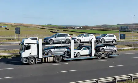 Multi-level car carrier on the motorway to Halifax, West Yorkshire, United Kingdom