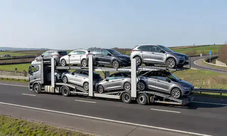 Multi-level car carrier on the motorway to Huddersfield, West Yorkshire, United Kingdom