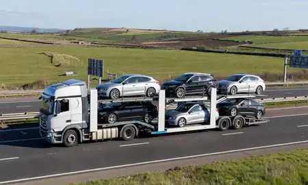 Multi-level car carrier on the motorway to Leeds, West Yorkshire, United Kingdom