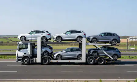 Multi-level car carrier on the motorway to Swindon, Wiltshire, United Kingdom