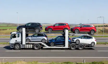 Multi-level car carrier on the motorway to Trowbridge, Wiltshire, United Kingdom