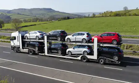 Multi-level car carrier on the motorway to Great Malvern, Worcestershire, United Kingdom