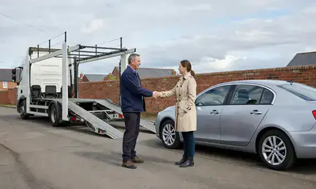 Vehicle owner beside their delivered car in Kidderminster, Worcestershire, United Kingdom