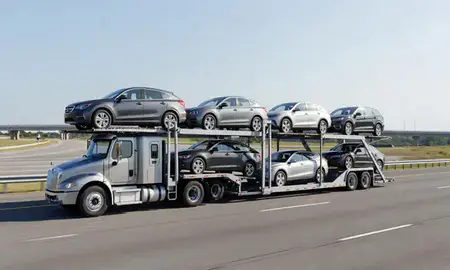 Multi-level car carrier on the highway to Alabaster, Alabama, United States