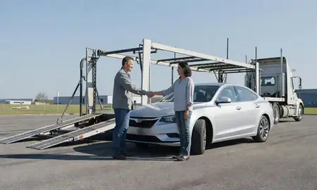 Vehicle owner beside their delivered car in Albertville, Alabama, United States