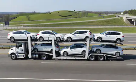 Multi-level car carrier on the highway to Anniston, Alabama, United States