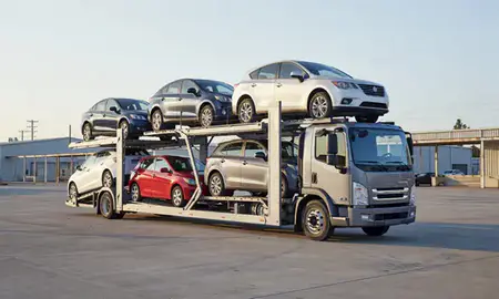Car transporter loaded with vehicles in Anniston, Alabama, United States