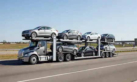 Multi-level car carrier on the highway to Athens, Alabama, United States