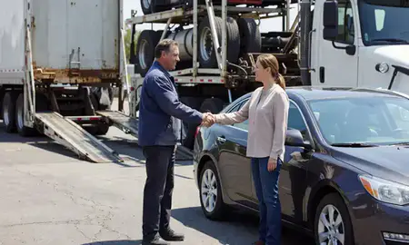 Vehicle owner beside their delivered car in Bessemer, Alabama, United States