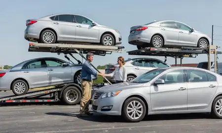 Vehicle owner beside their delivered car in Daphne, Alabama, United States
