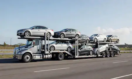 Multi-level car carrier on the highway to Dothan, Alabama, United States