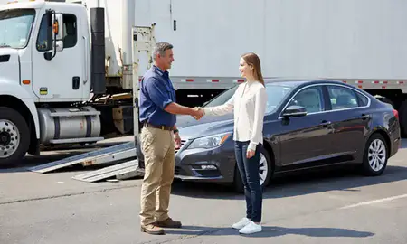 Vehicle owner beside their delivered car in Enterprise, Alabama, United States