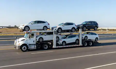 Multi-level car carrier on the highway to Fairhope, Alabama, United States