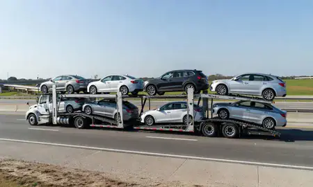 Multi-level car carrier on the highway to Florence, Alabama, United States