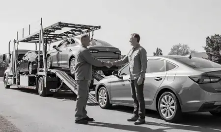 Vehicle owner beside their delivered car in Homewood, Alabama, United States