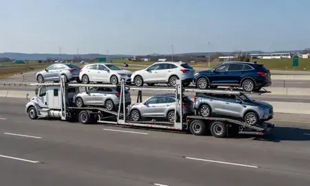 Multi-level car carrier on the highway to Huntsville, Alabama, United States
