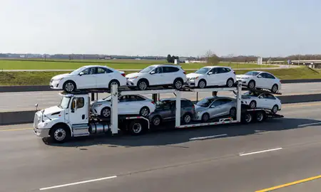 Multi-level car carrier on the highway to Madison, Alabama, United States