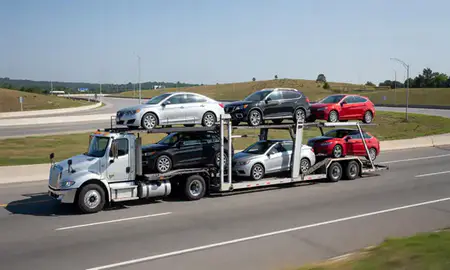Multi-level car carrier on the highway to Mountain Brook, Alabama, United States