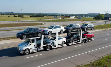 Multi-level car carrier on the highway to Northport, Alabama, United States
