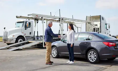 Vehicle owner beside their delivered car in Northport, Alabama, United States