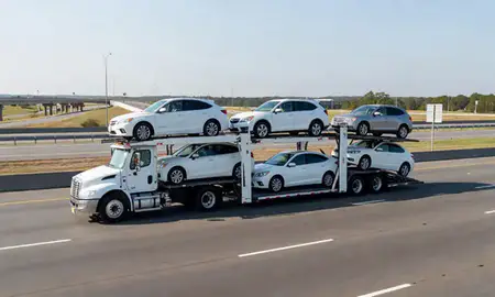 Multi-level car carrier on the highway to Opelika, Alabama, United States