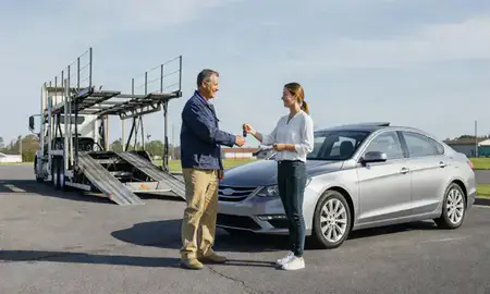Vehicle owner beside their delivered car in Oxford, Alabama, United States