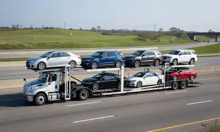 Multi-level car carrier on the highway to Pelham, Alabama, United States