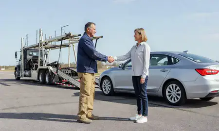 Vehicle owner beside their delivered car in Pelham, Alabama, United States