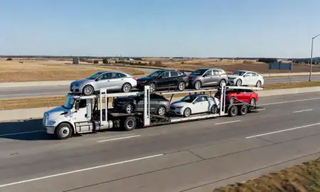 Multi-level car carrier on the highway to Prattville, Alabama, United States