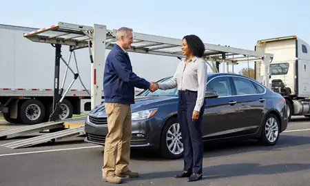Vehicle owner beside their delivered car in Vestavia Hills, Alabama, United States