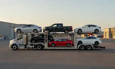 Car transporter parked in an industrial area of Alaska, United States