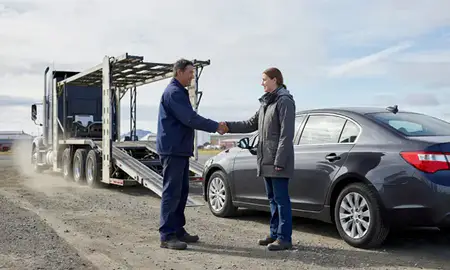 Vehicle owner beside their delivered car in Bethel, Alaska, United States