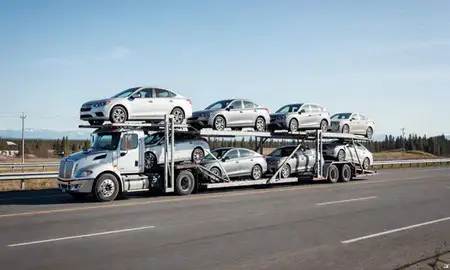 Multi-level car carrier on the highway to Fairbanks, Alaska, United States