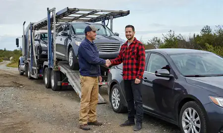 Vehicle owner beside their delivered car in Fishhook, Alaska, United States