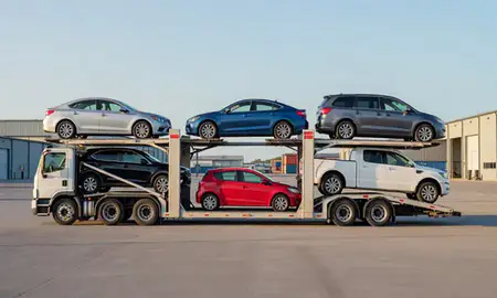 Car transporter parked in an industrial area of Fishhook, Alaska, United States