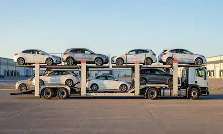 Car transporter parked in an industrial area of Homer, Alaska, United States